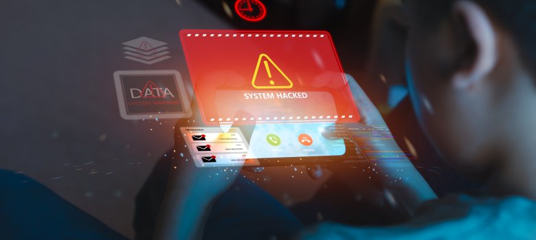 Cybersecurity warning concept with child holding smartphone showing system hacked alert. Digital data breach, online security risk, hacking, and cyber crime threat in modern technology