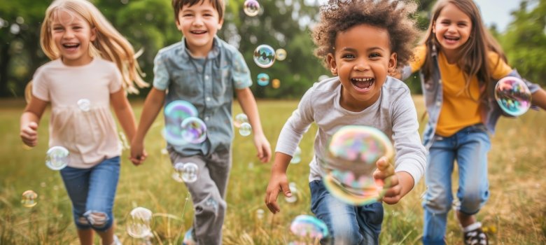 Diverse children enjoying outdoor fun with bubbles on a vibrant weekend activity Diverse children enjoying outdoor fun with bubbles on a vibrant weekend activity