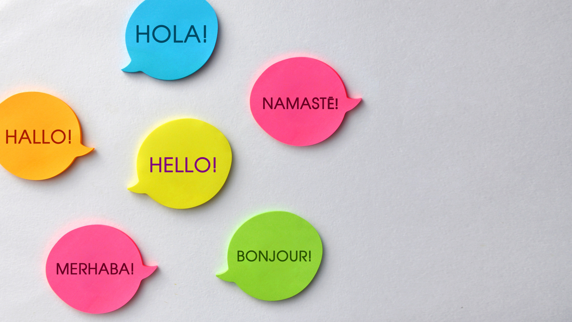 Language and Multinational Communication – Speech Bubbles with the Same Word in Different Languages, Intercultural Dialogue Concept