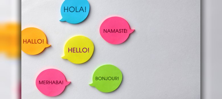 Language and Multinational Communication – Speech Bubbles with the Same Word in Different Languages, Intercultural Dialogue Concept Language and Multinational Communication – Speech Bubbles with the Same Word in Different Languages, Intercultural Dialogue Concept