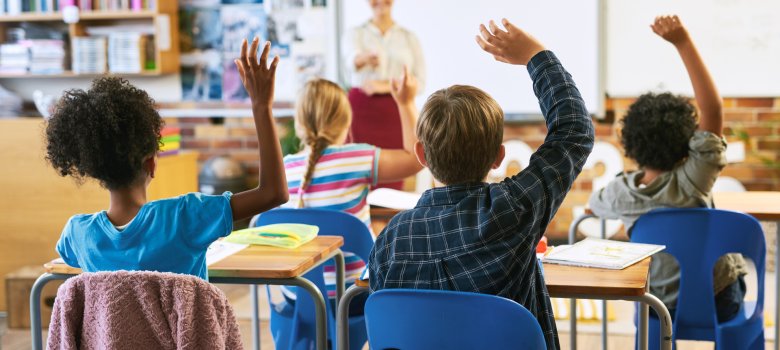 Education, question with group of children in classroom and raise their hands to answer. Learning or support, diversity and teacher teaching with young students in class of school building together Education, question with group of children in classroom and raise their hands to answer. Learning or support, diversity and teacher teaching with young students in class of school building together