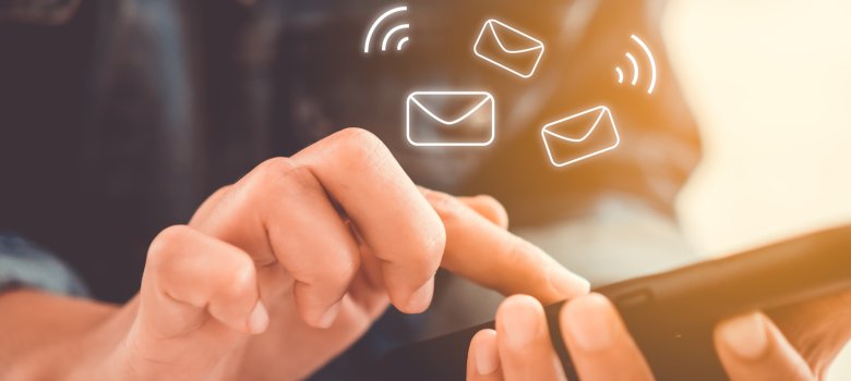 Woman hand using smartphone to send and recieve email.